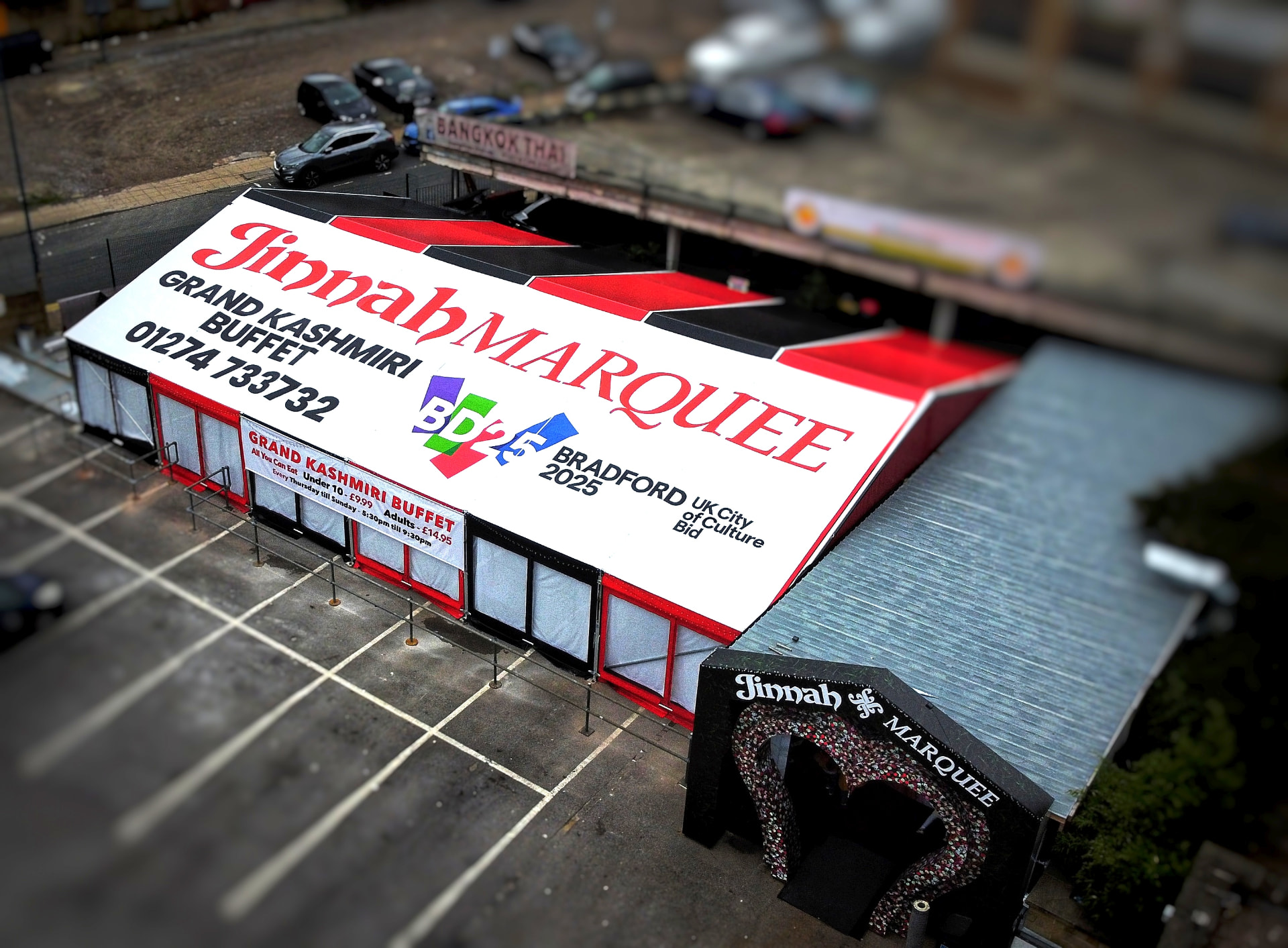 Aerial photograph of the Jinnah Marquee roof displaying Jinnah Marquee branding alongside the BD25 Bradford 2025 UK City of Culture Bid logo.